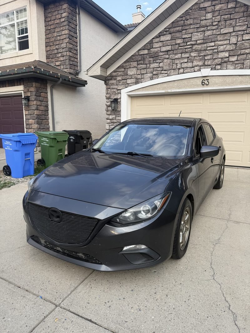 Mazda 3. Windshield replaced at the house.