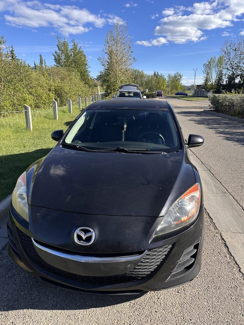 Mazda 3. Evening replacement on the street.