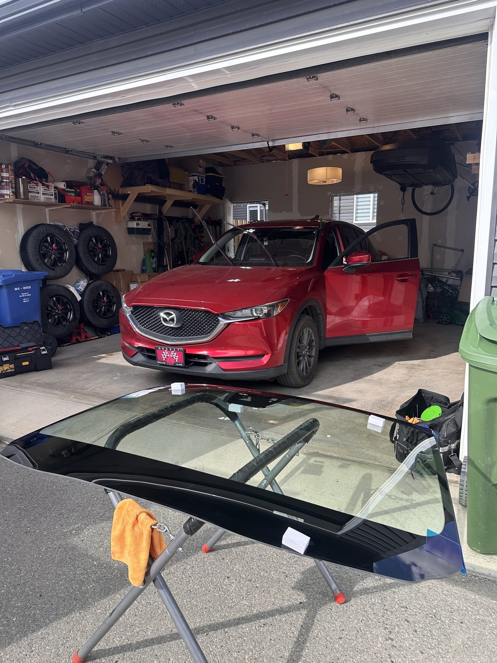 Mazda CX-5. Garage install, old windshield out.