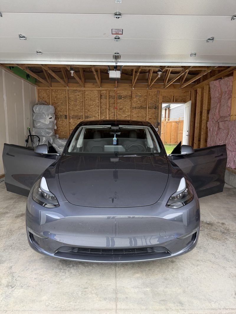 Tesla. Windshield replacement in the garage.